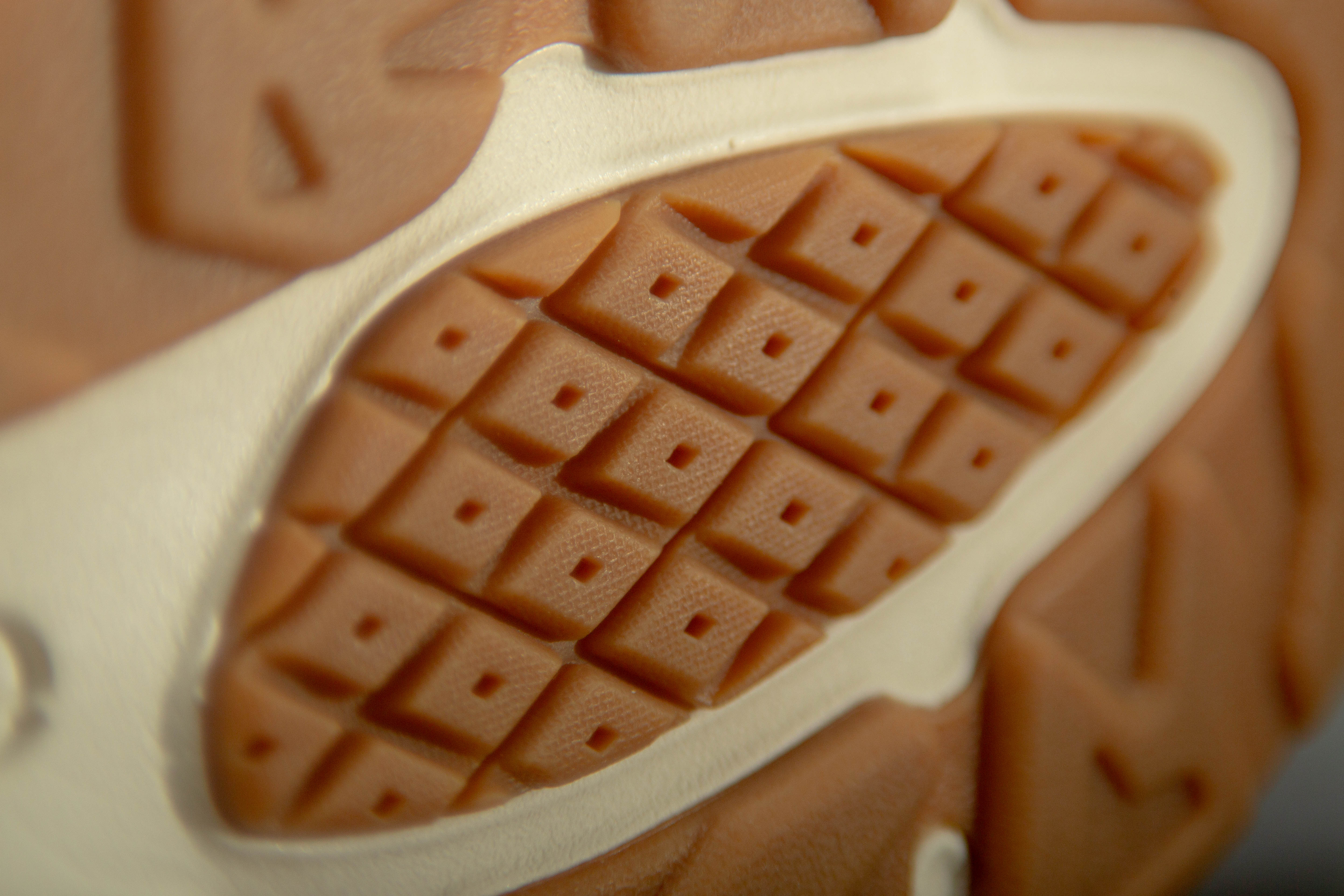 Debossed branding on the New Balance X-90 Reconstructed