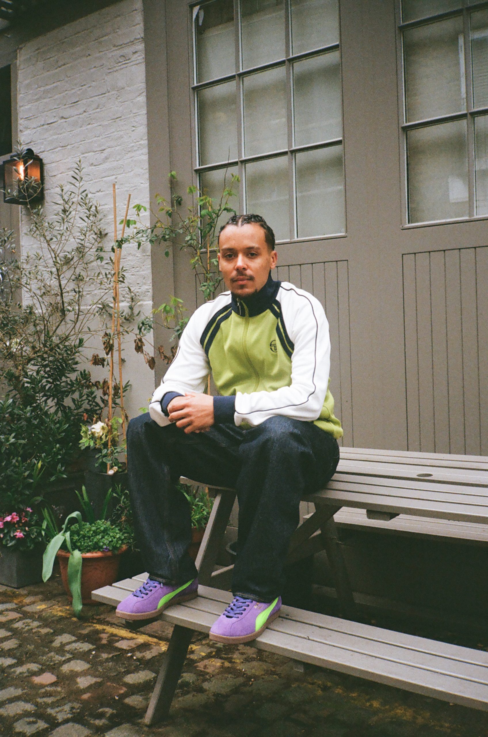 Person sat on picnic table wearing PUMA Brasil - size? exclusive